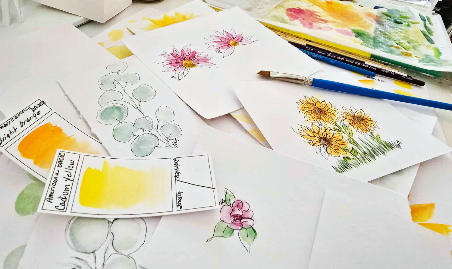 Painting table with coneflowers, eucalyptus and sunflowers 